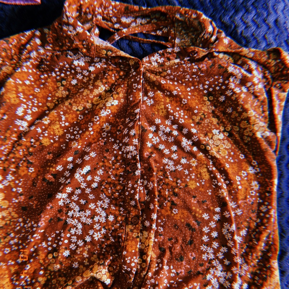 Floral brown shirt.